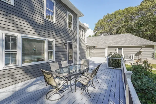 a view of a house with patio and wooden floor