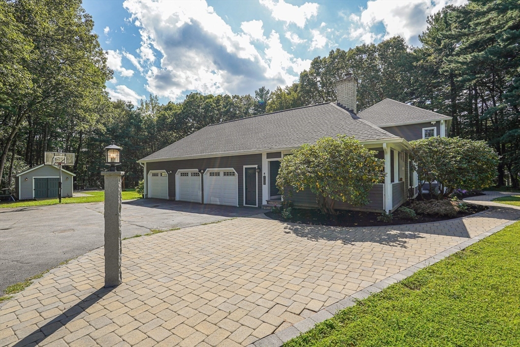 33 Woodstone Road Northborough, MA 01532 - Photo 4 of 42 a front view of a house with a yard and garage
