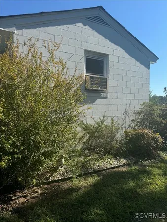 a view of house with backyard and garden