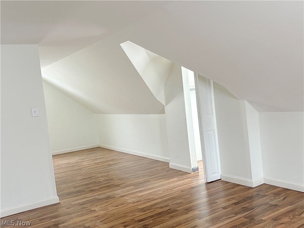 15521 Corkhill Road Maple Heights, OH 44137 - Photo 16 of 33 Additional living space with wood finished floors and vaulted ceiling