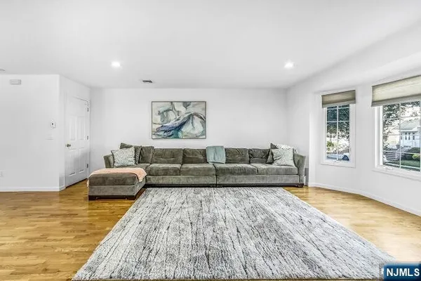 a living room with couch and a rug