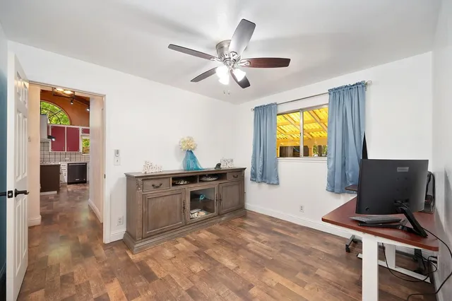 a workspace with furniture and window