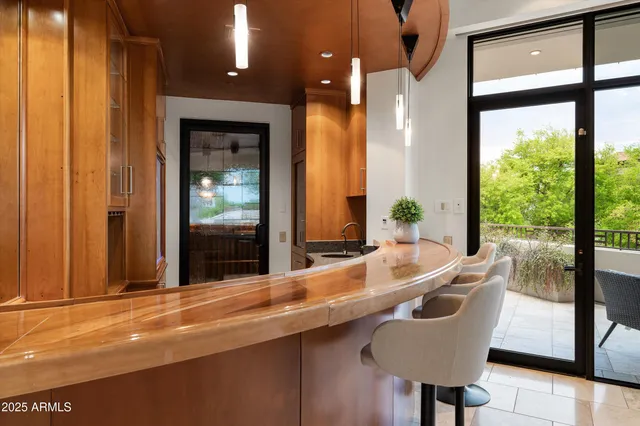 a bedroom with a large bed and a fireplace