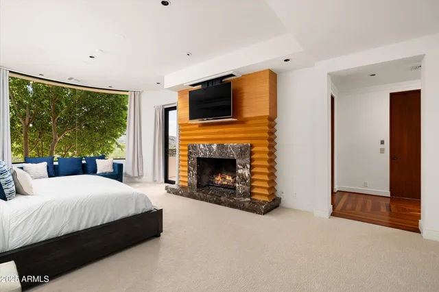 a bathroom with a sink a toilet a mirror a vanity and bathtub
