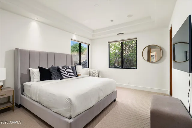 a balcony with wooden floor and outdoor seating