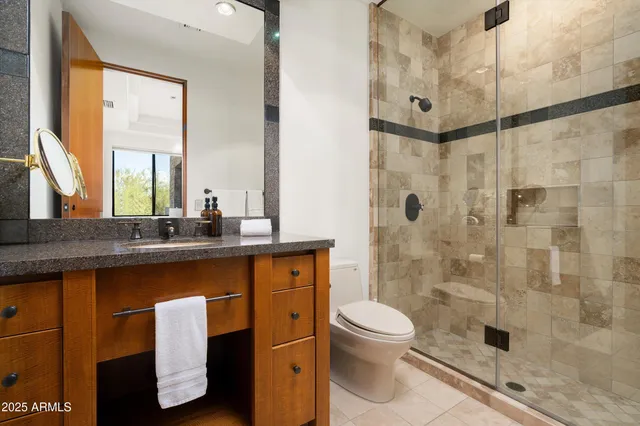 a kitchen with a stove sink and cabinets