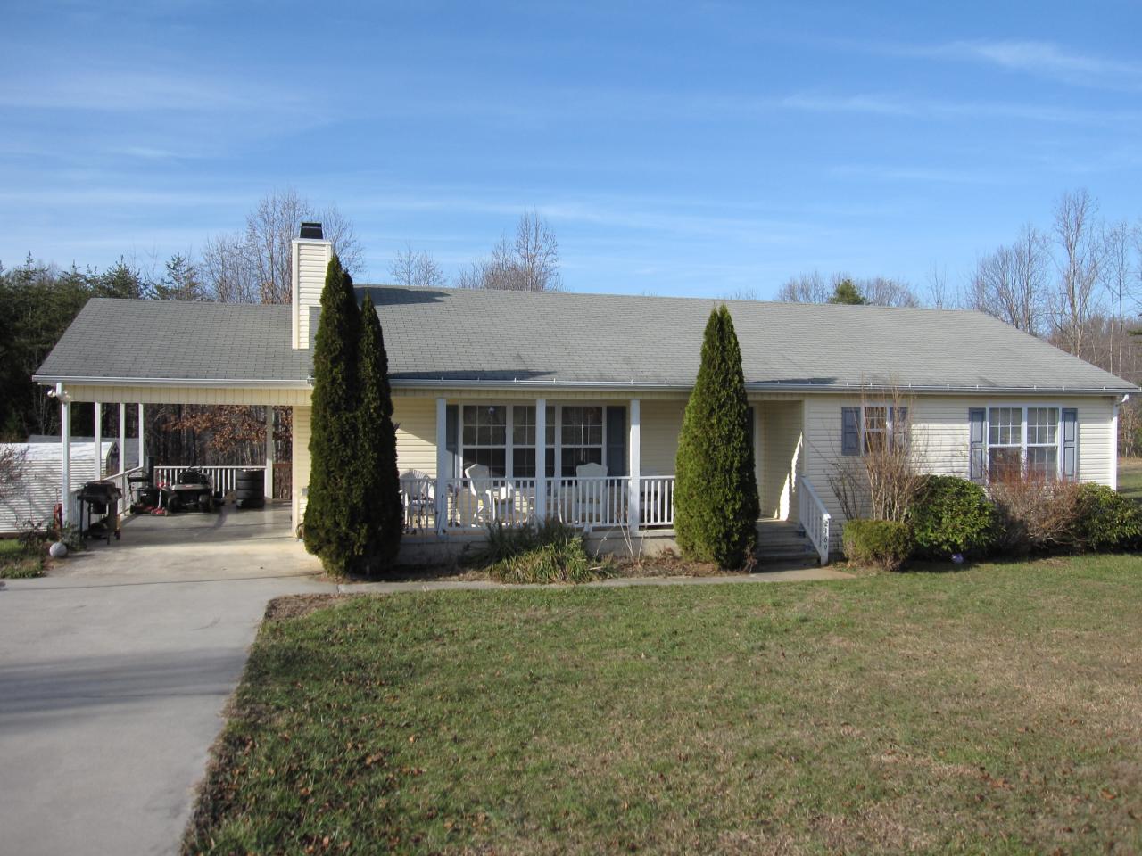 2169 Deep Woods Road Hardy, VA 24101 - Photo 1 of 37 a front view of a house with garden