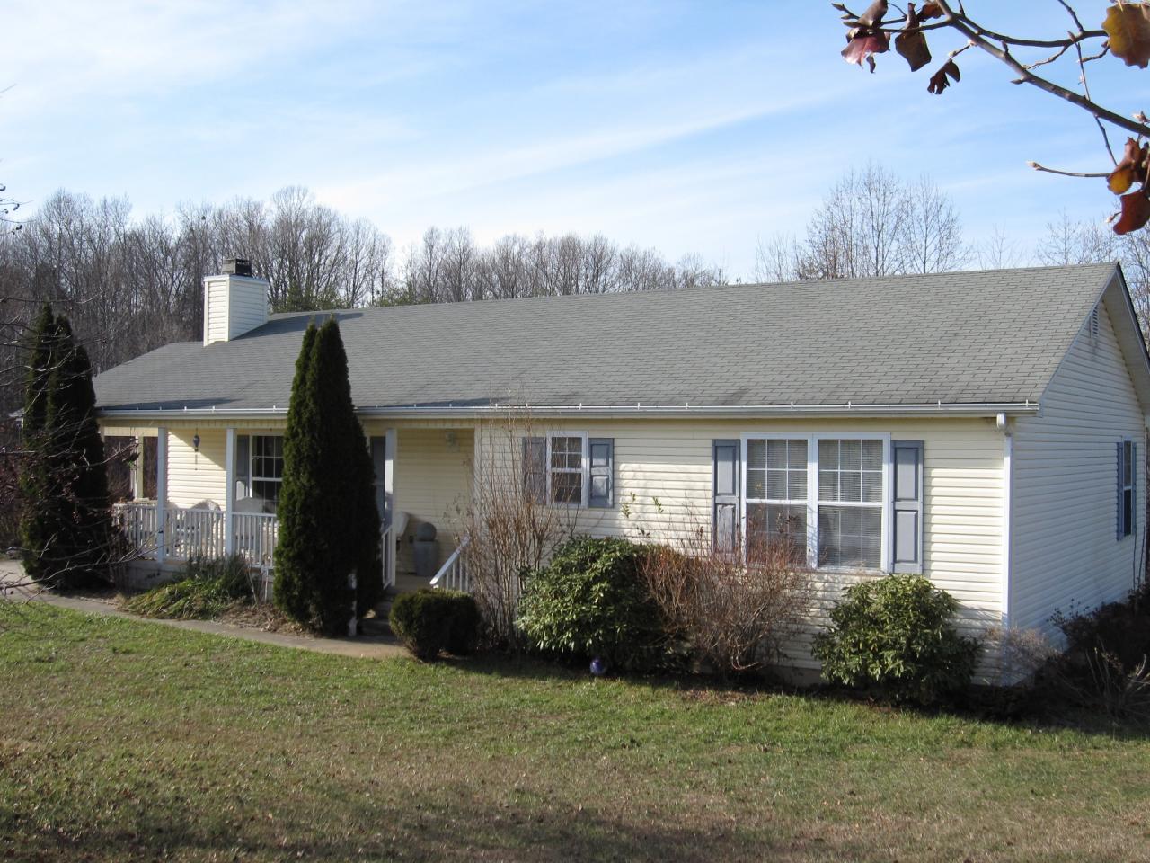 2169 Deep Woods Road Hardy, VA 24101 - Photo 15 of 37 a front view of a house with garden