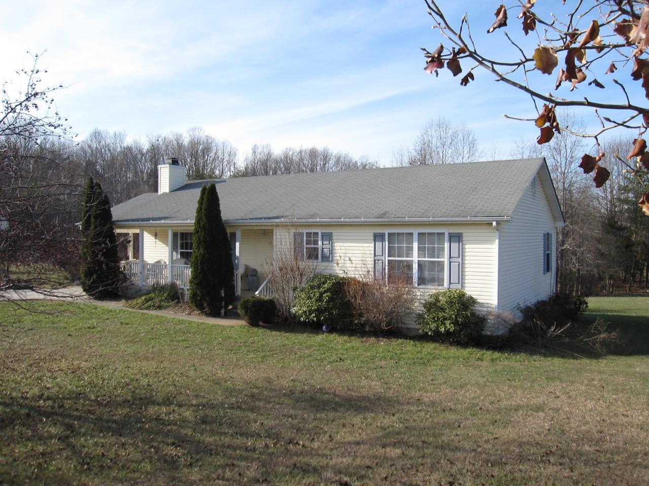 2169 Deep Woods Road Hardy, VA 24101 - Photo 16 of 37 a front view of a house with garden