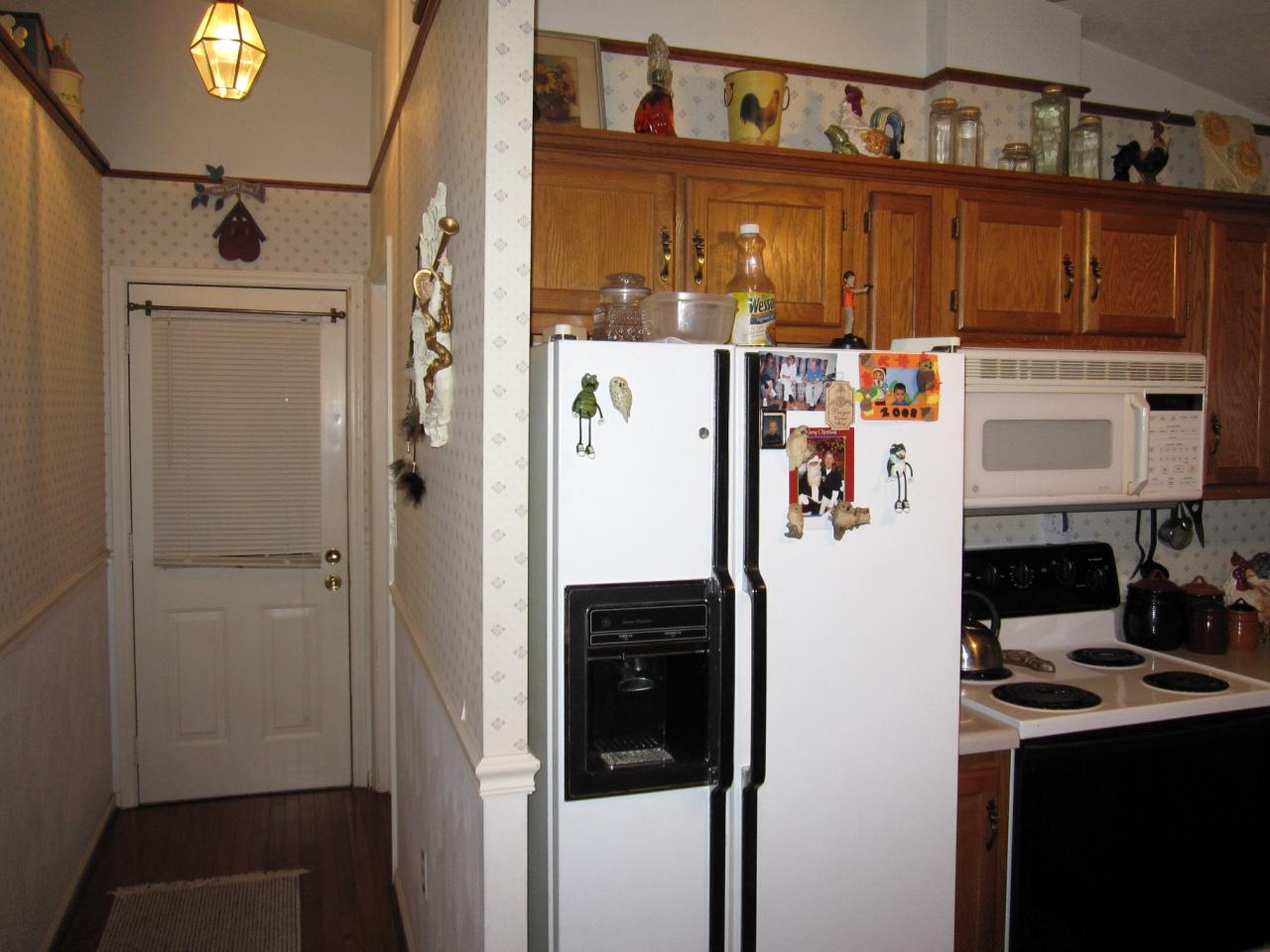 2169 Deep Woods Road Hardy, VA 24101 - Photo 27 of 37 a white refrigerator freezer and a stove sitting inside of a kitchen