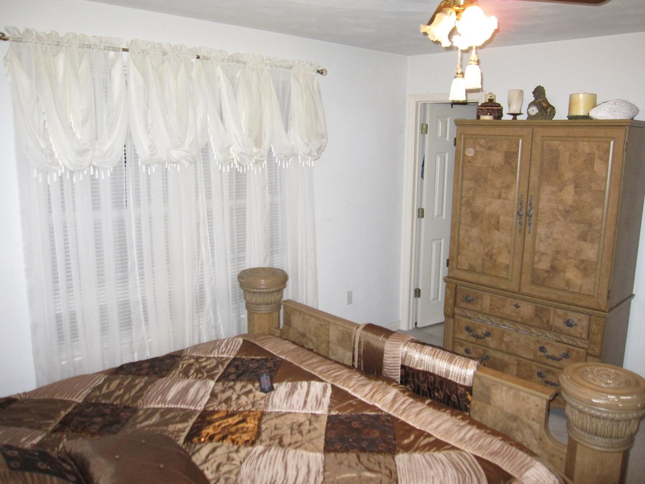 2169 Deep Woods Road Hardy, VA 24101 - Photo 35 of 37 a bedroom with a bed and a table chair