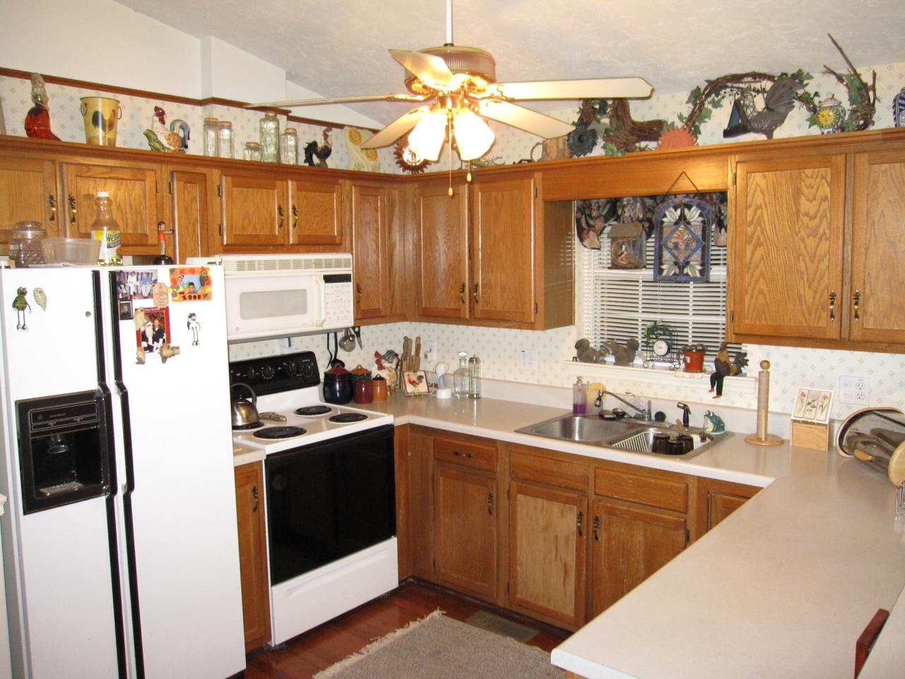 2169 Deep Woods Road Hardy, VA 24101 - Photo 5 of 37 a kitchen with a sink a refrigerator and cabinets