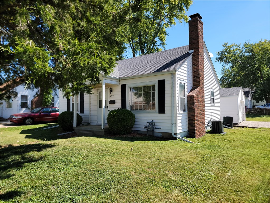 2195 West Center Street Decatur, IL 62526 - Photo 1 of 21 a view of a house with backyard and a tree
