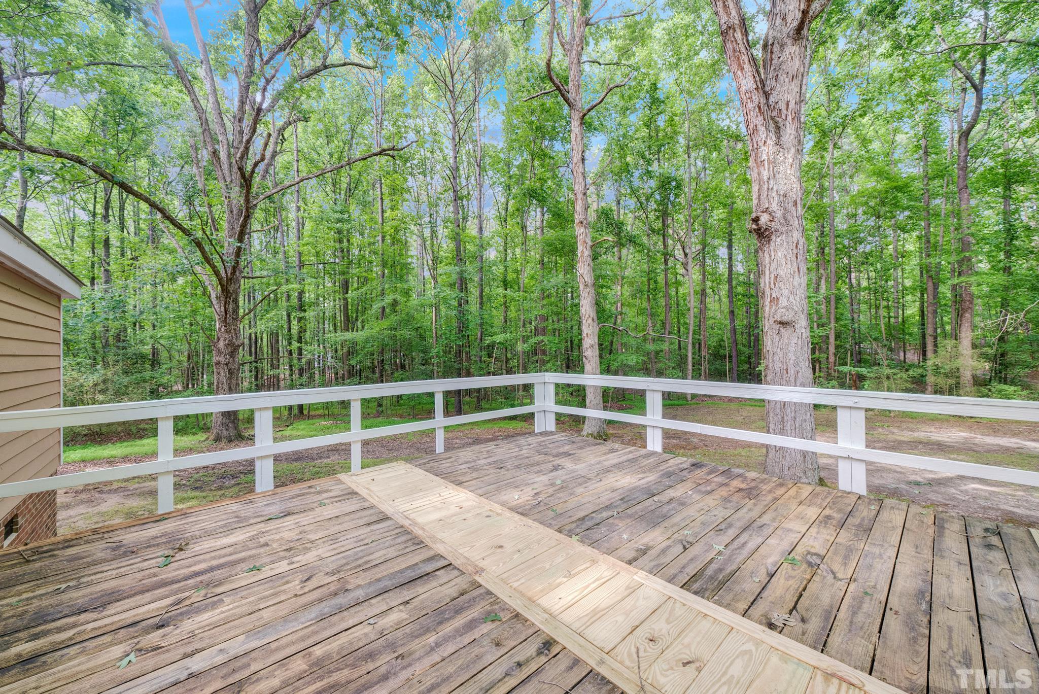 181 Simon Collie Road Louisburg, NC 27549 - Photo 22 of 26 a view of outdoor space with wooden floor and fence