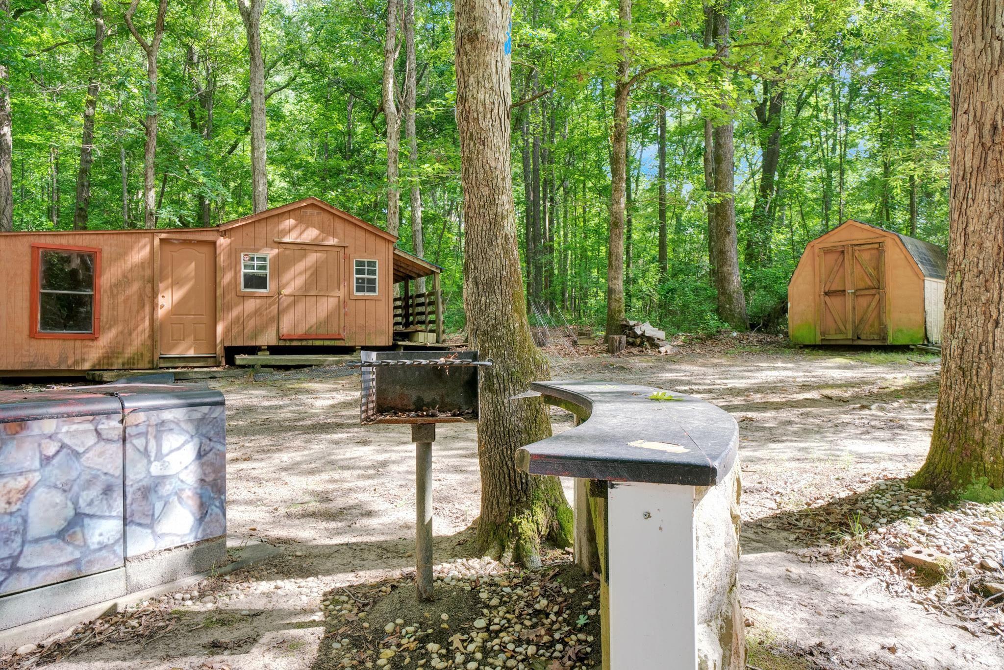 181 Simon Collie Road Louisburg, NC 27549 - Photo 24 of 26 a view of a house with a yard and large tree