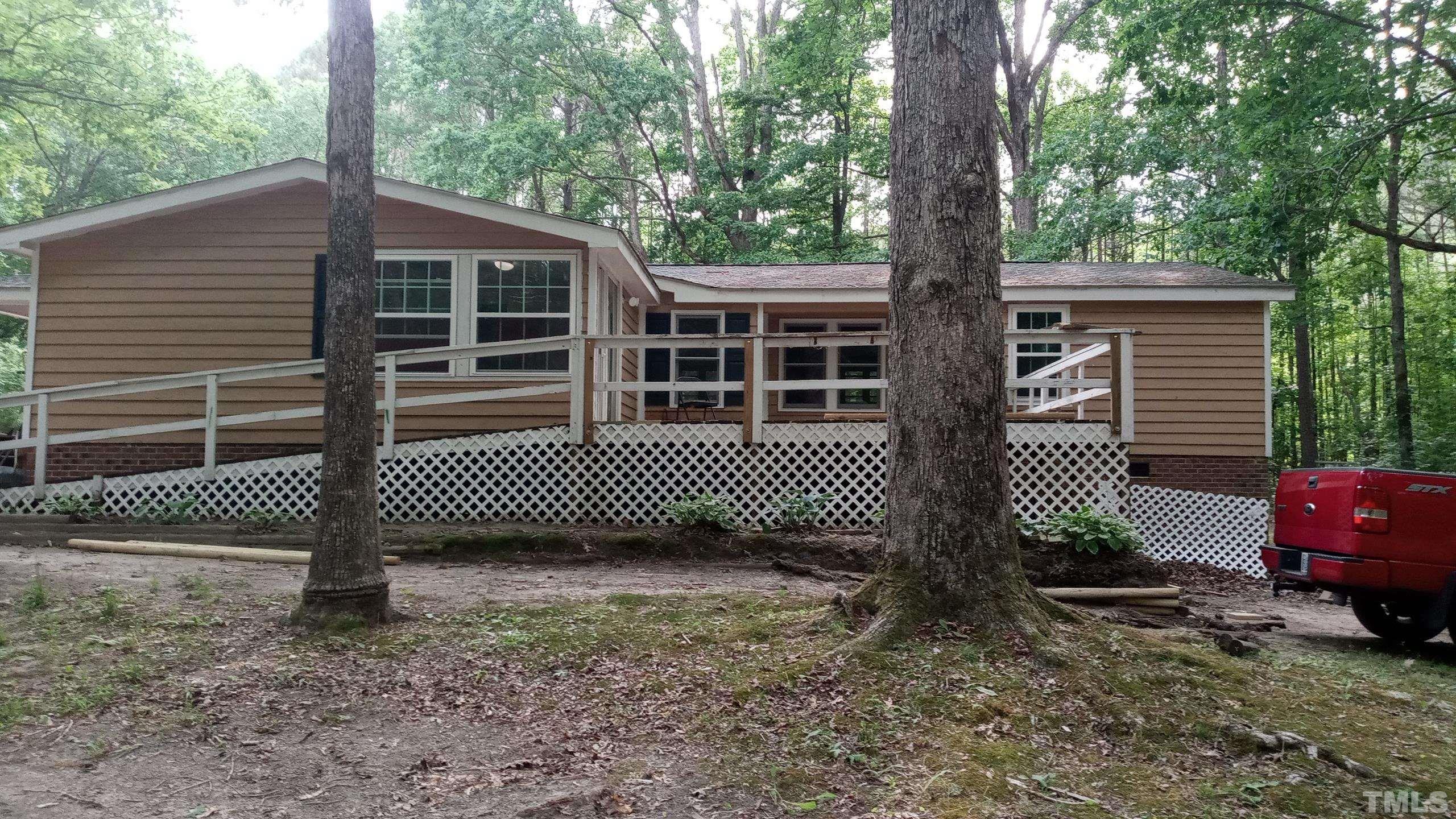 181 Simon Collie Road Louisburg, NC 27549 - Photo 3 of 26 a view of a house with a yard