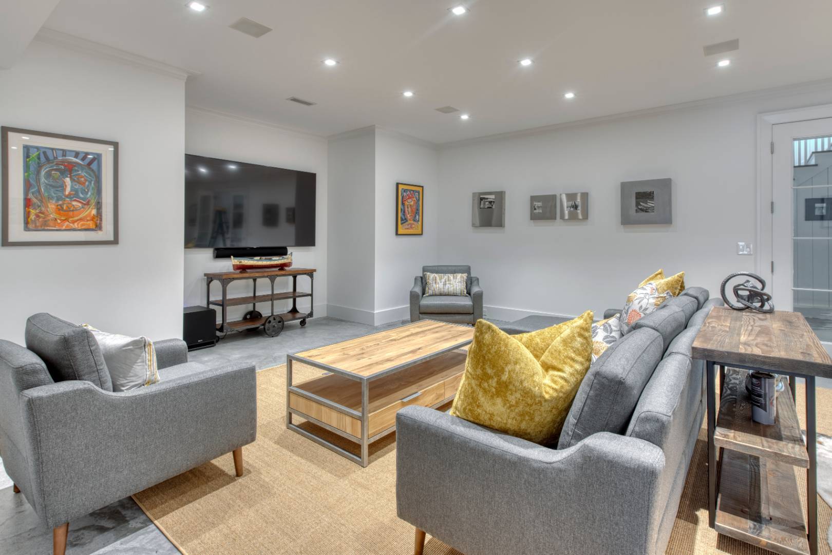 178 Bull Path East Hampton, NY 11937 - Photo 19 of 25 a living room with furniture and a flat screen tv