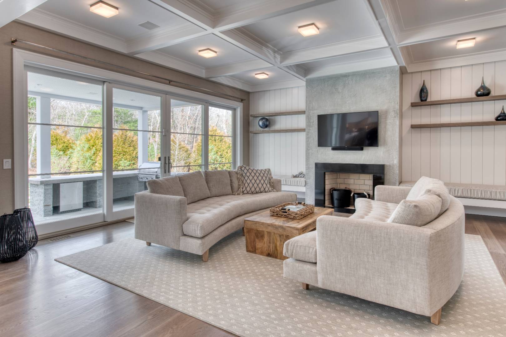 178 Bull Path East Hampton, NY 11937 - Photo 3 of 25 a living room with furniture a fireplace and a flat screen tv