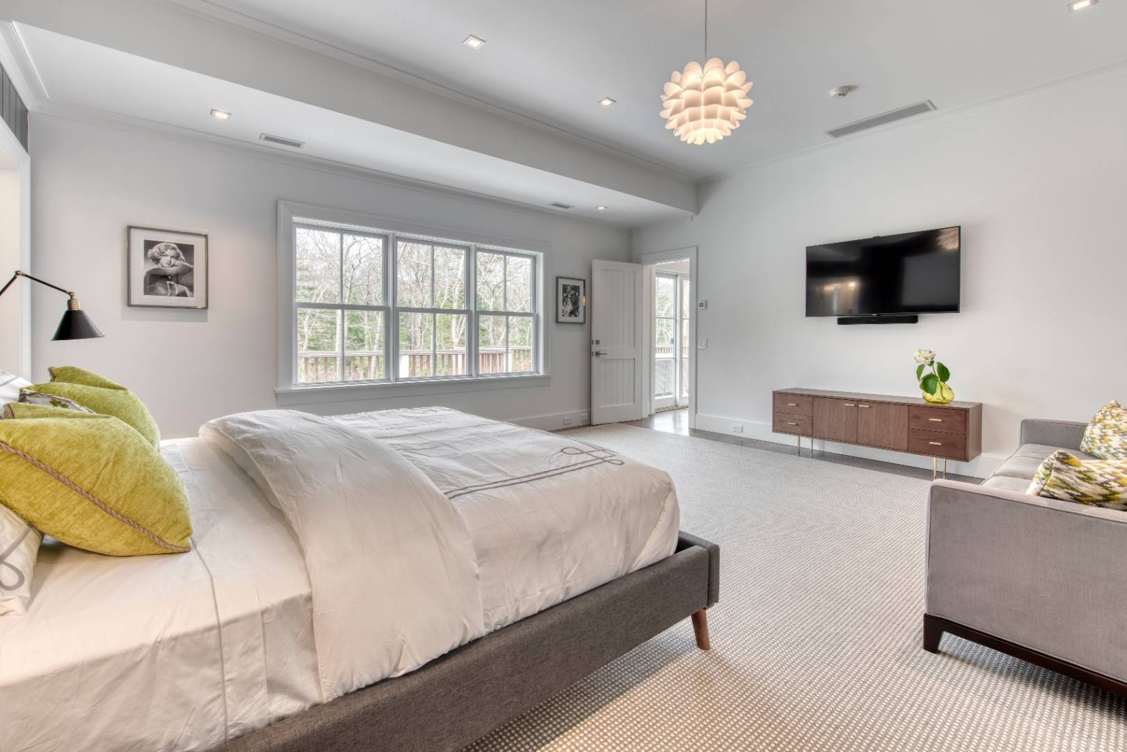 178 Bull Path East Hampton, NY 11937 - Photo 9 of 25 a spacious bedroom with a bed and a flat screen tv
