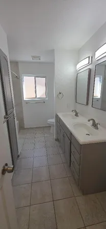 a bathroom with a sink a vanity and mirror
