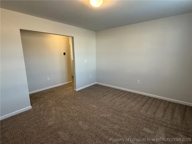 an empty room with a empty space and window