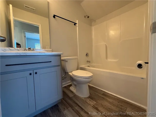 a view of kitchen with kitchen island and living room