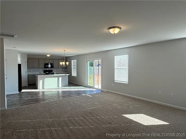 a kitchen with a sink stove and refrigerator