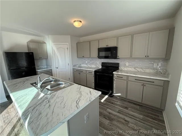 a view of a kitchen with a sink