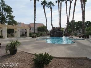 7570 West Flamingo Road, Unit 125 Las Vegas, NV 89147 - Photo 24 of 29 Community pool with a patio