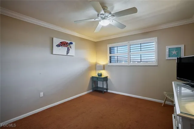 a room with a window and a ceiling fan