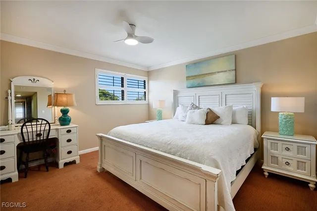a spacious bedroom with a bed and a chandelier