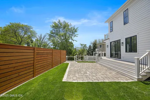 a view of a backyard with sitting area