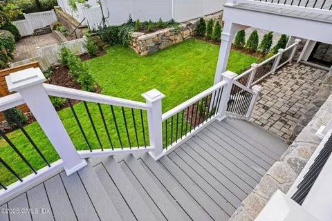 a view of balcony with wooden floor