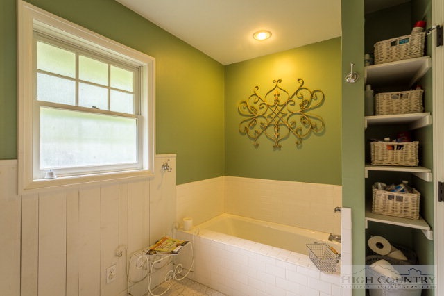 1115 Deck Hill Road Boone, NC 28607 - Photo 11 of 35 a bathroom with a tub and a shower