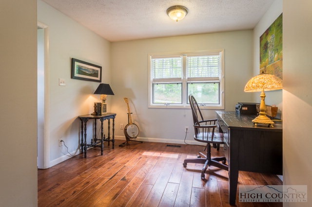 1115 Deck Hill Road Boone, NC 28607 - Photo 14 of 35 a workspace with furniture hardwood and a window