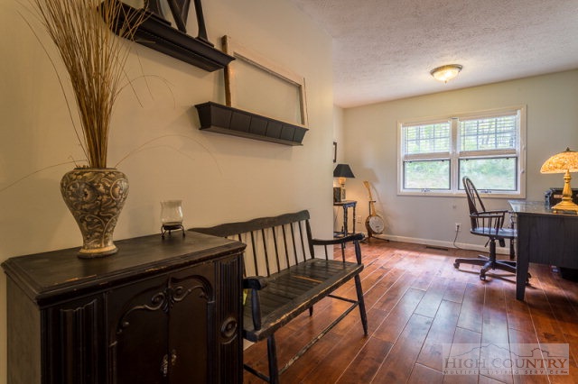 1115 Deck Hill Road Boone, NC 28607 - Photo 15 of 35 a view of a workspace with furniture and a window