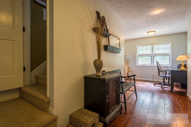 1115 Deck Hill Road Boone, NC 28607 - Photo 16 of 35 a living room with furniture and a wooden floor