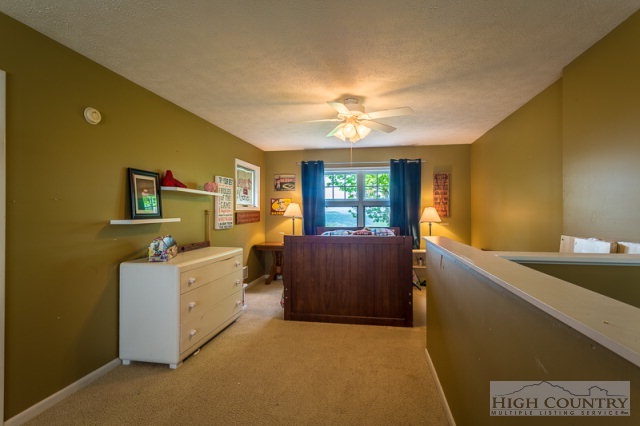 1115 Deck Hill Road Boone, NC 28607 - Photo 17 of 35 a view of a kitchen with furniture and a ceiling fan