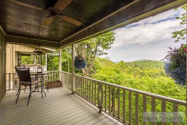 1115 Deck Hill Road Boone, NC 28607 - Photo 2 of 35 a view of a balcony with chairs
