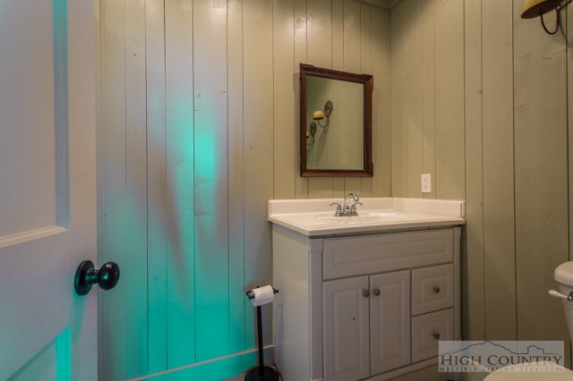 1115 Deck Hill Road Boone, NC 28607 - Photo 29 of 35 a bathroom with a sink and mirror