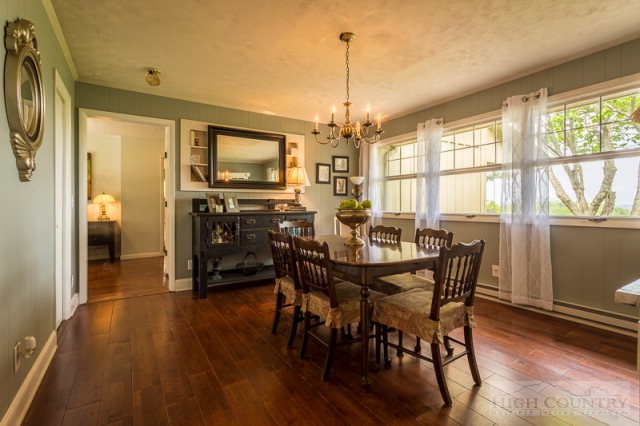 1115 Deck Hill Road Boone, NC 28607 - Photo 3 of 35 a view of a dining room with furniture window and wooden floor