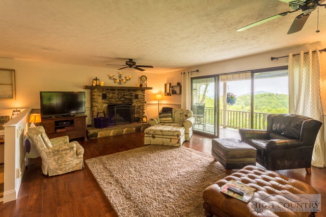 1115 Deck Hill Road Boone, NC 28607 - Photo 32 of 35 a living room with furniture and a flat screen tv