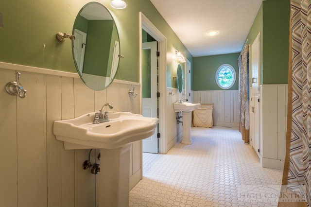 1115 Deck Hill Road Boone, NC 28607 - Photo 8 of 35 a en suite bathroom with a sink and mirror