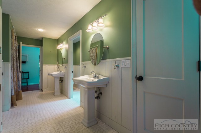 1115 Deck Hill Road Boone, NC 28607 - Photo 9 of 35 a view of bathroom with a sink and mirror