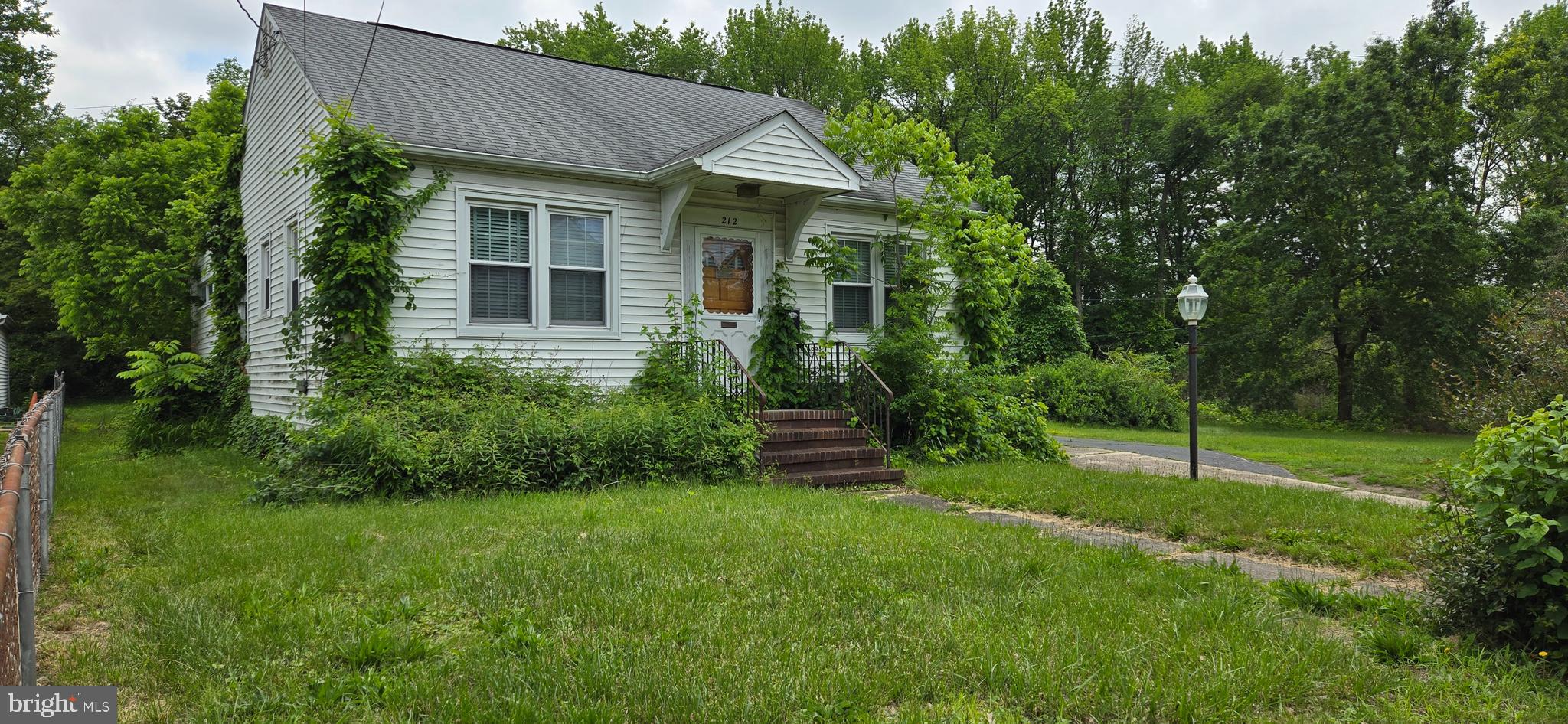 212 New Albany Road Moorestown, NJ 08057 - Photo 2 of 3 a view of a house with a backyard