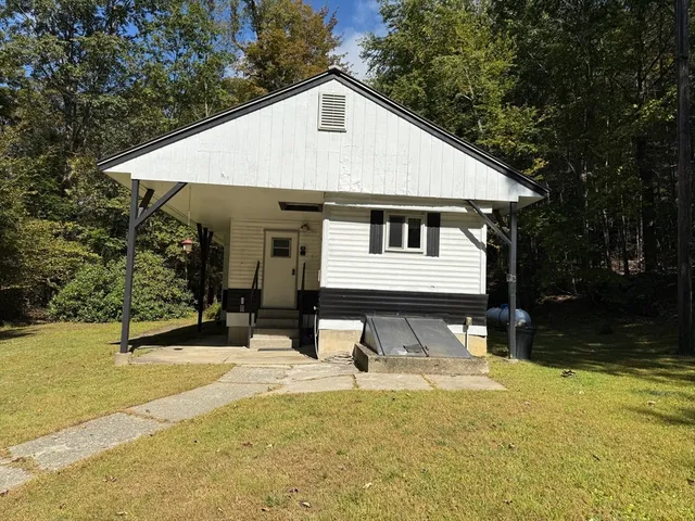 a front view of a house with a yard