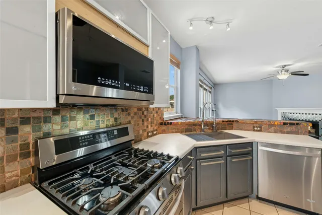 a kitchen with a stove and a microwave