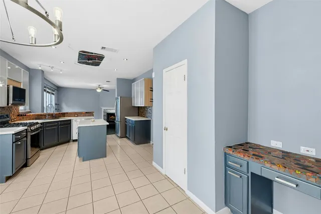 a kitchen with a sink and a stove top oven