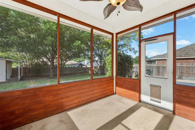 a view of a room with wooden floor and city view