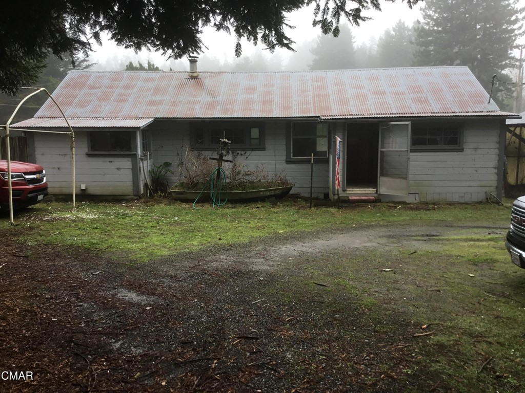 32601 Albion Ridge Road Albion, CA 95410 - Photo 1 of 1 a front view of a house with a garden